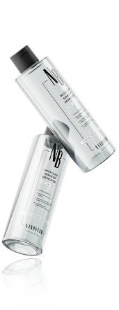 Two transparent bottles of makeup remover