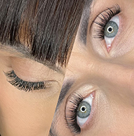 A close-up of a woman showcasing her long eyelashes